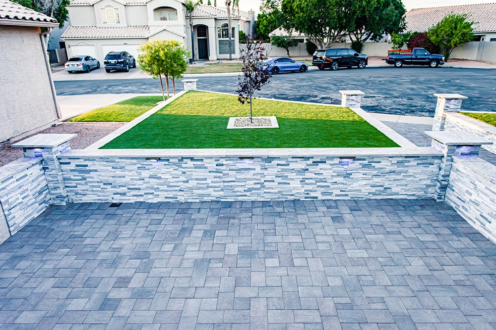 Modern Front Yard with Paver Patio, Artificial Grass, and Stone Wall